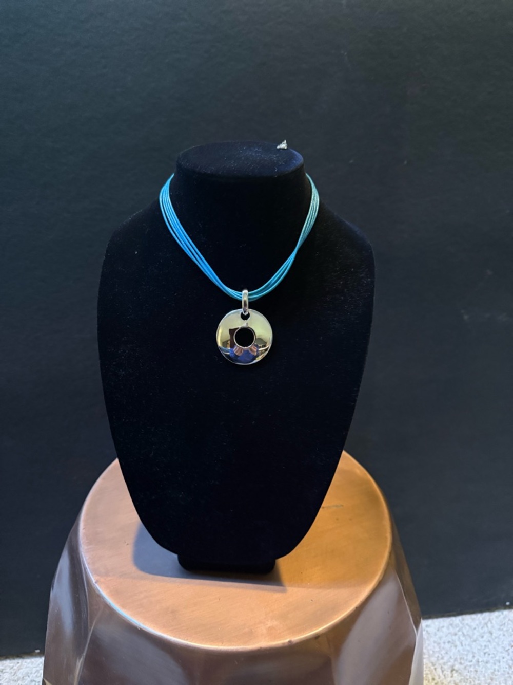 Source Unknown Silver Ring Pendant on Aqua Multi-Strand Cord
